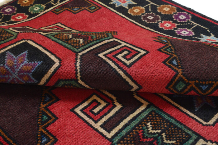 Vintage Baluchi rug 4'7 x 2'10 ft, crafted in deep red, black, and ivory geometric motifs. Durable, washable, and available in San Francisco showrooms."