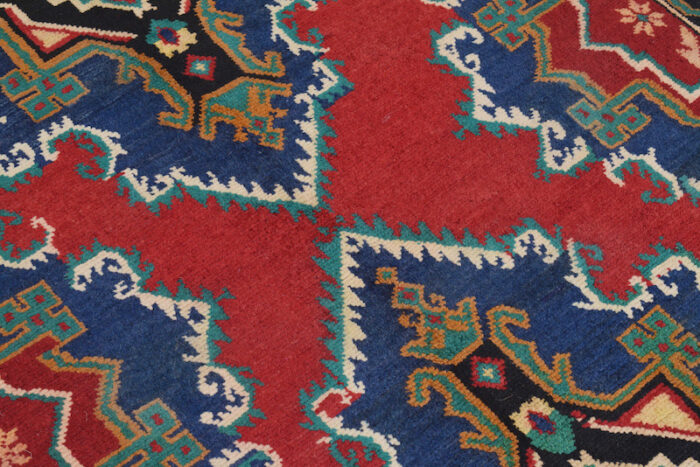 Handwoven Afghan Baluch rug 6'8 x 3'10 ft in red and navy with intricate geometric medallions. Available in Sausalito, San Francisco, and Berkeley