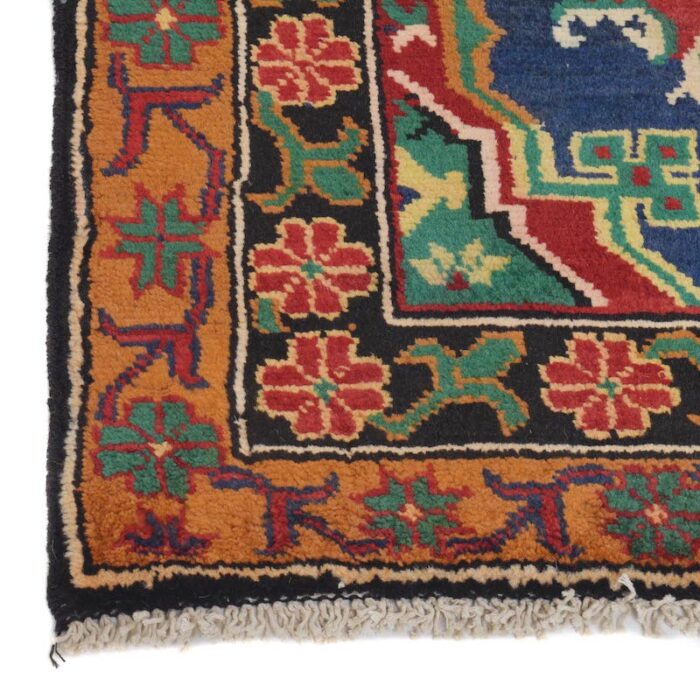 Vintage Baluchi rug 6'8 x 3'10 ft, featuring a rich red background with navy and ivory tribal patterns. Durable, washable, and available in Sausalito, CA