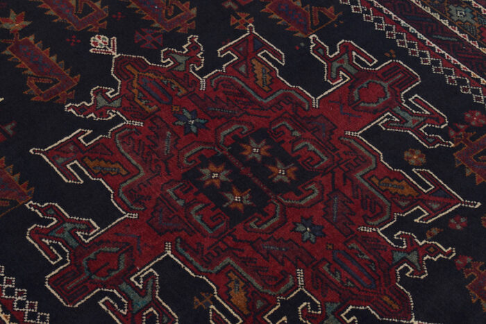 Handwoven wool Afghan rug featuring intricate tribal patterns in rust, black, and ivory – ideal for modern and classic interiors