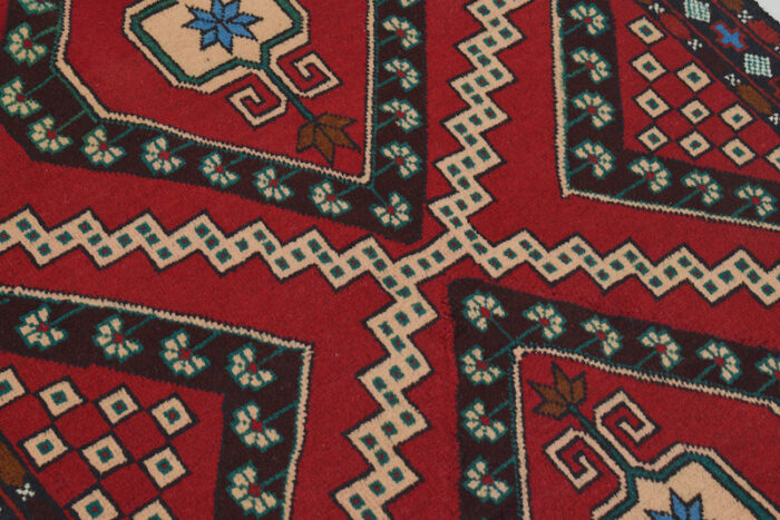 Geometric Afghan tribal rug with a red base and intricate border details. 4'6 x 2'10 ft, available in San Rafael, Berkeley, and San Francisco showrooms.