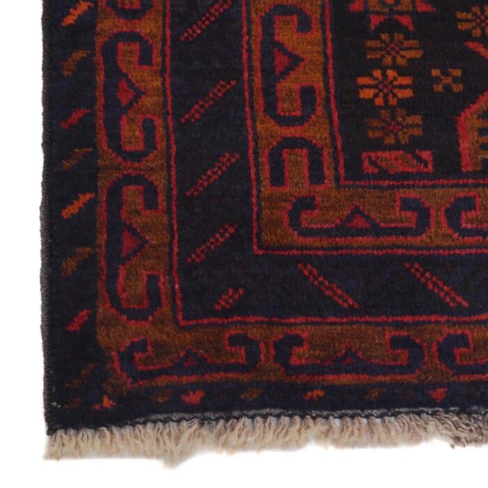 Traditional Afghan wool rug with geometric medallions in black, deep red, and copper, handwoven for durability