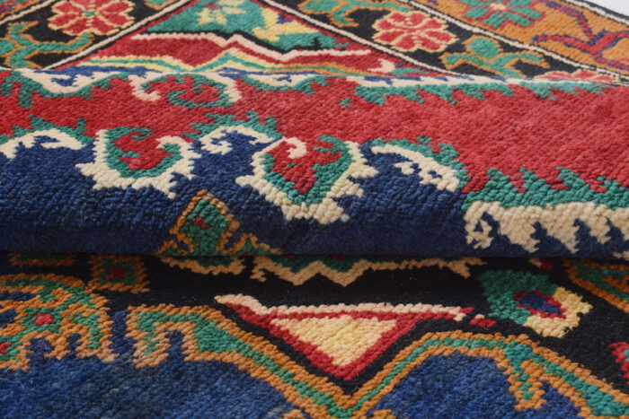 Geometric Afghan tribal rug with a red base and decorative blue border patterns. 6'8 x 3'10 ft, available in Sausalito, Berkeley, and San Francisco showrooms