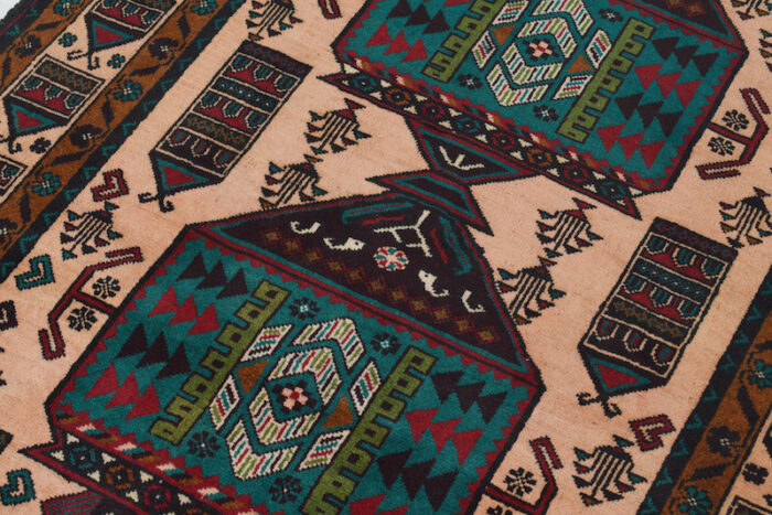 Long-lasting Afghan Baluchi rug featuring rich tribal patterns and durable, animal-friendly wool.