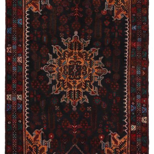 Authentic Afghan tribal wool rug with bold medallion motifs in black and rust. 6'8 x 4'1 ft, washable and available with free USA shipping.