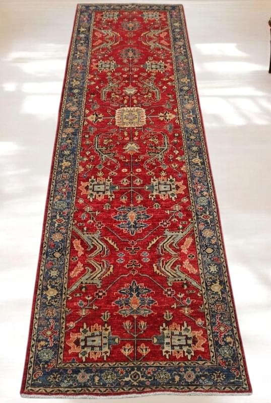 Handwoven 3.2x11.10 red and navy Heriz runner rug with bold geometric medallions.